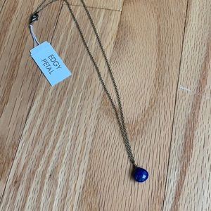 Edgy Petal 16” necklace with navy blue stone.